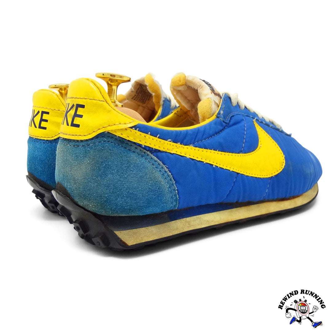 Blue and yellow nike running sales shoes